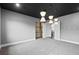 A bonus room offers flexible living space with modern design, light grey carpet, and unique light fixtures at 4065 Isabella Cir, Windermere, FL 34786