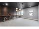 Spacious bonus room with custom bar area featuring stylish pendant lighting and modern finishes at 4065 Isabella Cir, Windermere, FL 34786