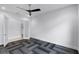 Modern bonus room featuring unique geometric flooring, ceiling fan, and white walls for a flexible space at 4065 Isabella Cir, Windermere, FL 34786