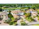 Stunning lakefront property showcasing a luxurious estate with a grand entrance and meticulously landscaped grounds at 4065 Isabella Cir, Windermere, FL 34786