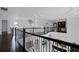 An upstairs landing of a home with hardwood floors and wrought iron railing at 4065 Isabella Cir, Windermere, FL 34786