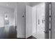 Hallway with views of a bathroom and light-filled living space with dark hardwood floors at 4065 Isabella Cir, Windermere, FL 34786