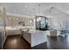 Gourmet kitchen with granite countertops, pendant lighting, and stainless steel appliances in an open concept home at 4065 Isabella Cir, Windermere, FL 34786