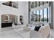 Sophisticated living room featuring a soaring window, fireplace and elegant décor, creating an inviting and luxurious space at 4065 Isabella Cir, Windermere, FL 34786