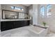 Luxurious main bathroom with a soaking tub, large mirrors, and modern fixtures at 4065 Isabella Cir, Windermere, FL 34786