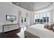 Well-lit main bedroom with decorative ceiling, patio access, and scenic views at 4065 Isabella Cir, Windermere, FL 34786