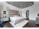Spacious main bedroom with elegant decor, statement ceiling, and stylish furnishings at 4065 Isabella Cir, Windermere, FL 34786