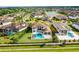 This beautiful home features a backyard pool and spa, surrounded by a manicured lawn at 4065 Isabella Cir, Windermere, FL 34786