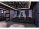 Enjoy movie nights in this theater room featuring plush seating, ambient lighting, and modern design at 4065 Isabella Cir, Windermere, FL 34786