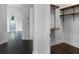 Organized walk-in closet with built-in shelving and wooden floors for maximum storage convenience at 4065 Isabella Cir, Windermere, FL 34786