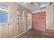 Small back porch area featuring brick wall, vinyl siding, and linoleum flooring at 4279 Bomber Rd, Bartow, FL 33830