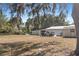 Spacious lot, featuring outbuildings under mature trees at 4279 Bomber Rd, Bartow, FL 33830