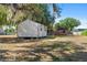 Backyard featuring an outbuilding with brick home in the background at 4279 Bomber Rd, Bartow, FL 33830