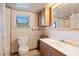 Functional bathroom with a toilet, vanity, and shower, designed for everyday convenience at 4279 Bomber Rd, Bartow, FL 33830