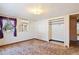 Bedroom featuring a window, air conditioning unit, and an open closet, offering ample space at 4279 Bomber Rd, Bartow, FL 33830