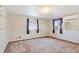 Bedroom showcasing windows, air conditioning, and patterned wallpaper, creating a comfortable space at 4279 Bomber Rd, Bartow, FL 33830