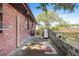 Brick home exterior featuring an outside concrete patio with an AC unit at 4279 Bomber Rd, Bartow, FL 33830