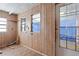 A full view of the room featuring paneled walls, built-in shelves, and a back door at 4279 Bomber Rd, Bartow, FL 33830