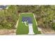 Aerial shot of new construction home on a spacious lot, surrounded by mature trees and lush greenery at 4364 Sw 172Nd Street Rd, Ocala, FL 34473