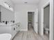 Bathroom with dual sink vanity, modern fixtures, and tiled shower at 4364 Sw 172Nd Street Rd, Ocala, FL 34473