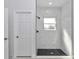 Bathroom showing a frameless glass shower with tiled walls and black accents at 4364 Sw 172Nd Street Rd, Ocala, FL 34473