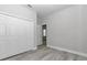 Bedroom with closet, wood-look floors, and a neutral color palette at 4364 Sw 172Nd Street Rd, Ocala, FL 34473