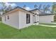 A modern single-Gathering home with black trim, a manicured lawn and green grass at 4364 Sw 172Nd Street Rd, Ocala, FL 34473