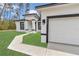 Charming new construction home featuring a bright exterior, manicured lawn, and stylish black trim at 4364 Sw 172Nd Street Rd, Ocala, FL 34473