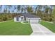 Charming single-story home with a well-manicured lawn and a two-car garage at 4364 Sw 172Nd Street Rd, Ocala, FL 34473
