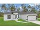 Attractive single-story home with black trim, and a manicured front lawn at 4364 Sw 172Nd Street Rd, Ocala, FL 34473