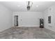 Spacious garage featuring concrete floors, water heater, and access door to inside at 4364 Sw 172Nd Street Rd, Ocala, FL 34473