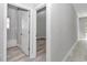 Hallway leading to a bathroom and bedroom, with light-colored walls and wood-look flooring at 4364 Sw 172Nd Street Rd, Ocala, FL 34473