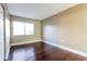 The bedroom features gleaming wood floors and a bright, airy ambiance with ample light at 4727 S Texas Ave # 4727C, Orlando, FL 32839