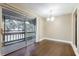 Dining room with sliding glass door to balcony and a chandelier light fixture at 4727 S Texas Ave # 4727C, Orlando, FL 32839