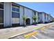 Exterior of the condominium complex features convenient parking spaces and landscaping at 4727 S Texas Ave # 4727C, Orlando, FL 32839