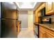 Kitchen with stainless steel appliances, tile flooring, and wood cabinets at 4727 S Texas Ave # 4727C, Orlando, FL 32839