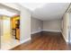 Open-concept living and kitchen area with hardwood floors and stainless steel appliances at 4727 S Texas Ave # 4727C, Orlando, FL 32839