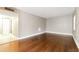 Bright living room featuring hardwood floors, neutral paint, and natural light at 4727 S Texas Ave # 4727C, Orlando, FL 32839