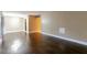 Spacious living room with hardwood floors and neutral paint at 4727 S Texas Ave # 4727C, Orlando, FL 32839