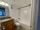 Bright bathroom featuring a vanity with granite countertop and a shower-tub combination at 4749 S Texas Ave # 4749B, Orlando, FL 32839