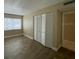 Neutral bedroom featuring lots of closet space and a sunny window at 4749 S Texas Ave # 4749B, Orlando, FL 32839
