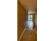 Hallway with tile floor, neutral walls, and glimpse of a sliding glass door at 4749 S Texas Ave # 4749B, Orlando, FL 32839