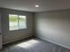Bedroom features large windows, neutral walls, and carpet flooring at 5113 Prairie Preserve Run, St Cloud, FL 34772