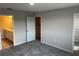 A neutral-toned bedroom with carpeted floors, attached bathroom, and walk-in closet at 5113 Prairie Preserve Run, St Cloud, FL 34772