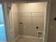 Functional laundry room with washer/dryer hookups, wire shelving for storage, and a conveniently placed utility sink at 5113 Prairie Preserve Run, St Cloud, FL 34772
