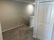Carpeted stairs with neutral walls and white trim lead to the next level at 5113 Prairie Preserve Run, St Cloud, FL 34772