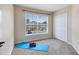 Cozy bedroom featuring large window views and a double-door closet at 600 Northern Way # 1807, Winter Springs, FL 32708