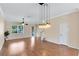 Spacious living room featuring hardwood floors and modern lighting at 600 Northern Way # 1807, Winter Springs, FL 32708