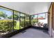 Enclosed patio with outdoor seating and views of the manicured backyard at 600 Northern Way # 1807, Winter Springs, FL 32708