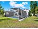 Exterior view of screened lanai with pool, offering a private outdoor living and entertaining space at 80 White Marsh Cir, Orlando, FL 32824